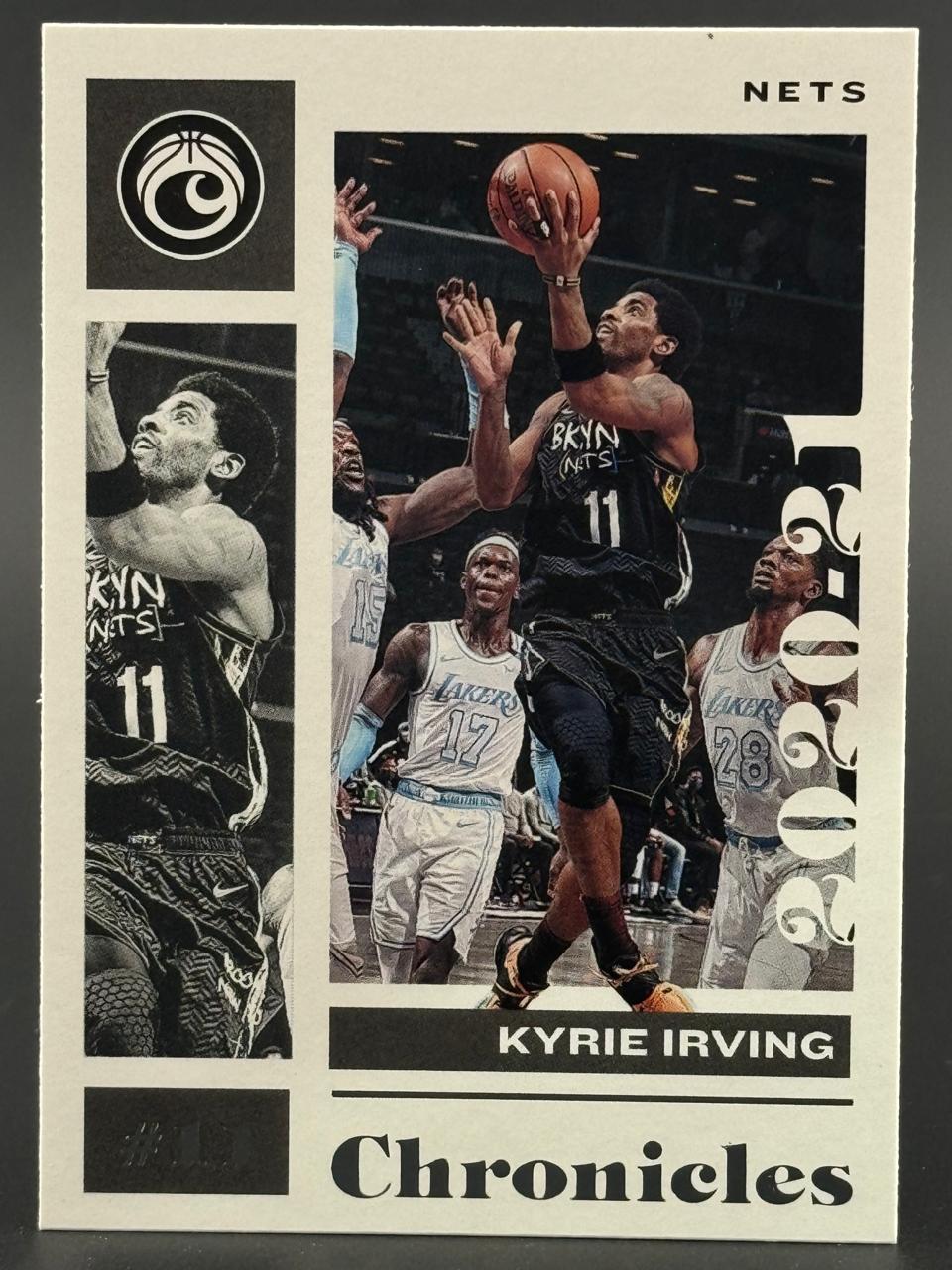 2020-21 Panini Chronicles Kyrie Irving basketball card showing him shooting with Lakers defenders around him.