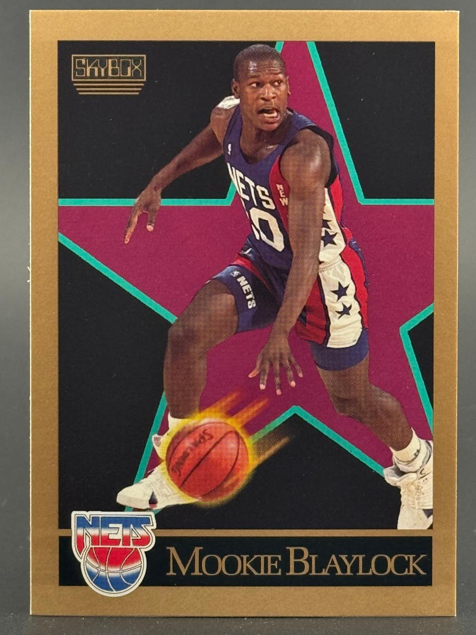 1990 SkyBox Mookie Blaylock basketball card featuring him dribbling with a motion-blurred ball.