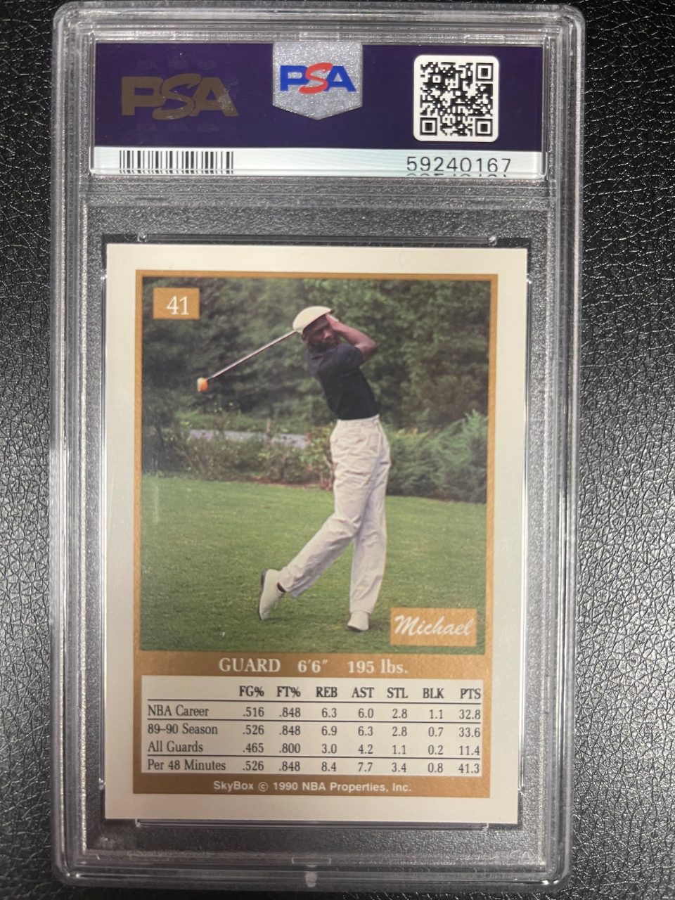 1990 SkyBox Michael Jordan card #41 in PSA slab, showing Jordan swinging a golf club outdoors.