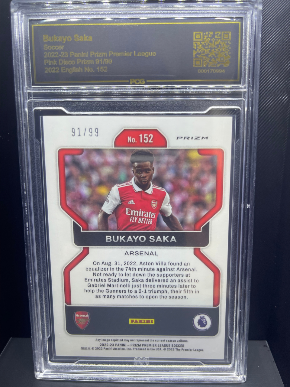 2022-23 Panini Prizm Premier League Bukayo Saka card #152, Pink Disco parallel, numbered 91/99 in PCG slab.