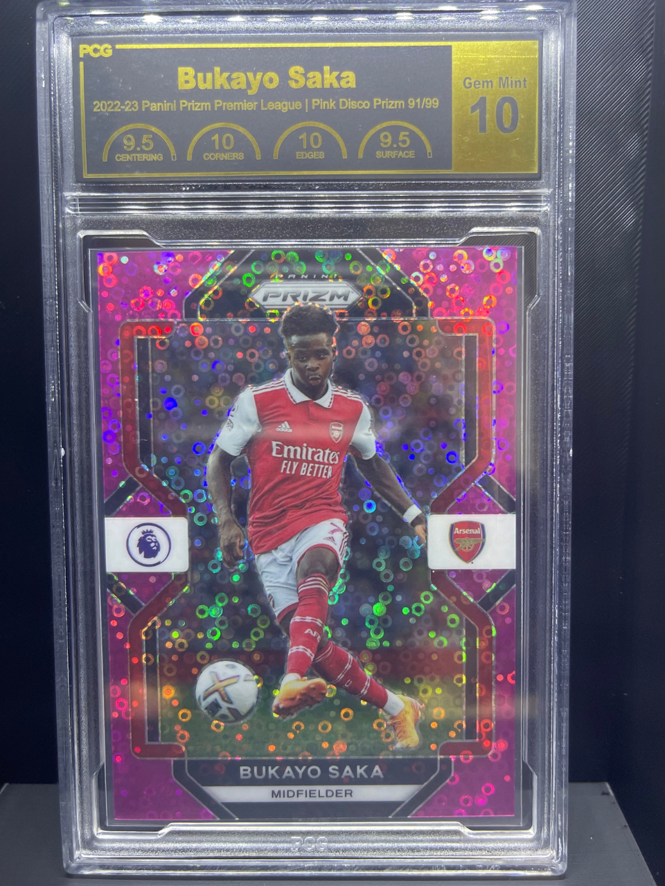 PCG 10 Bukayo Saka 2022-23 Panini Prizm Pink Disco 91/99 trading card.