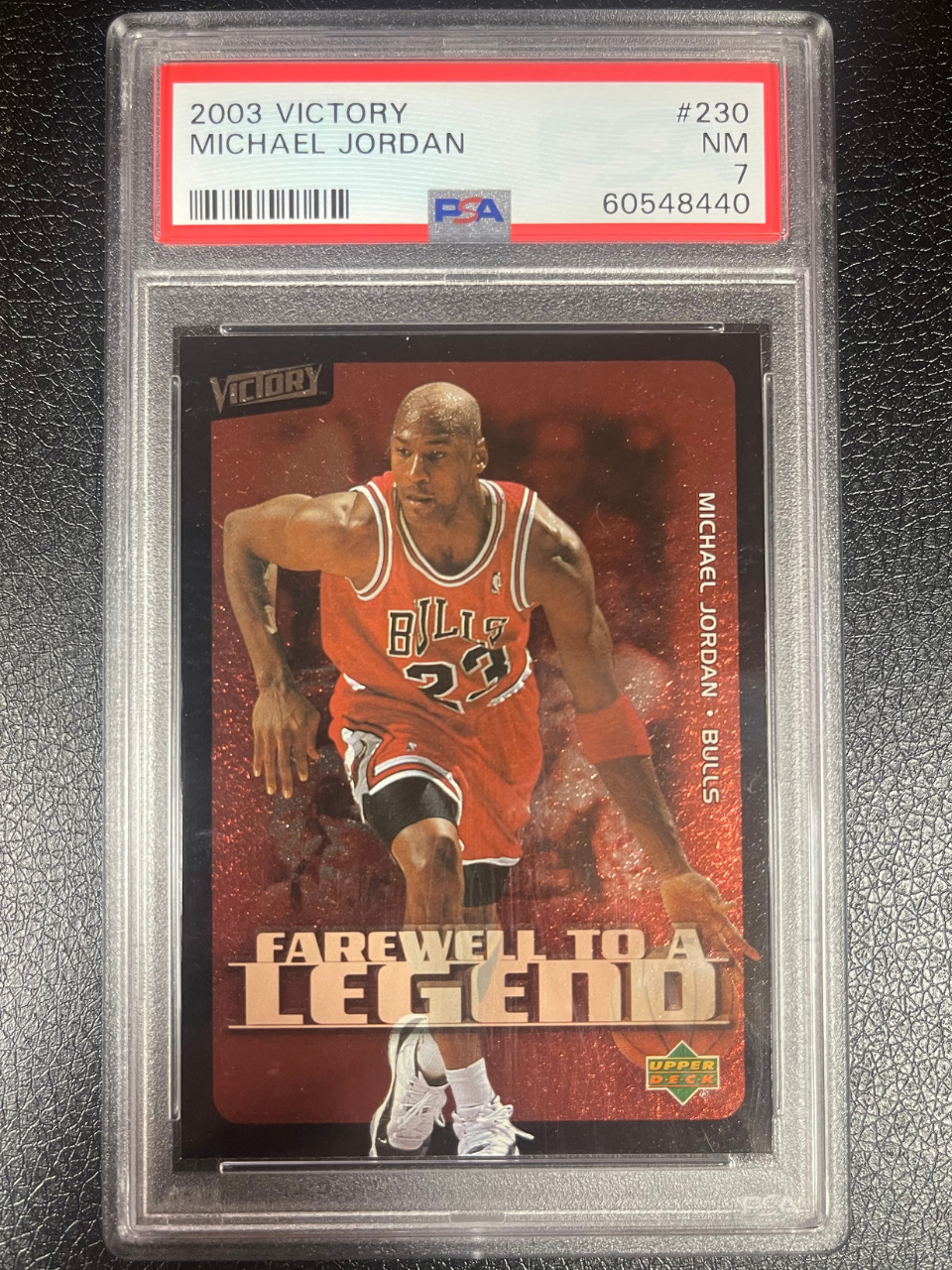 PSA 7 2003 Victory Michael Jordan #230 trading card in a slab.