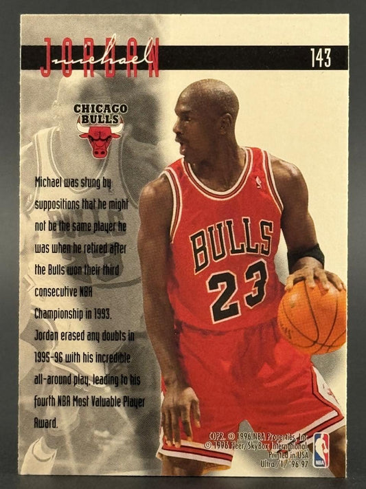 1996-97 Fleer Ultra Michael Jordan card #143, featuring him in a red Bulls uniform holding a basketball.