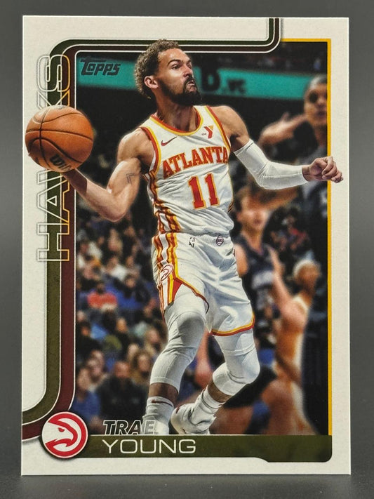 Trae Young 2023 Topps basketball card, number 11, showing Young in an Atlanta Hawks uniform holding a basketball.