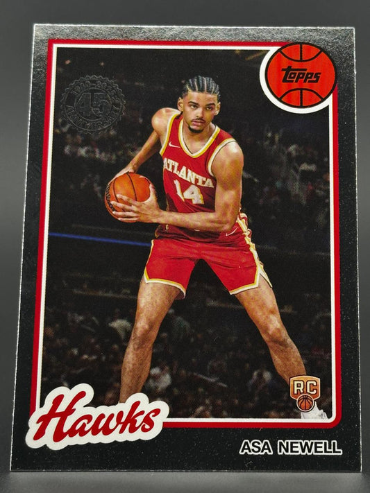 2024-25 Topps Asa Newell rookie trading card featuring the Atlanta Hawks player in a red uniform holding a basketball.