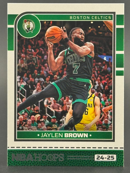 24-25 NBA Hoops Jaylen Brown trading card, featuring the Boston Celtics player airborne with a basketball.