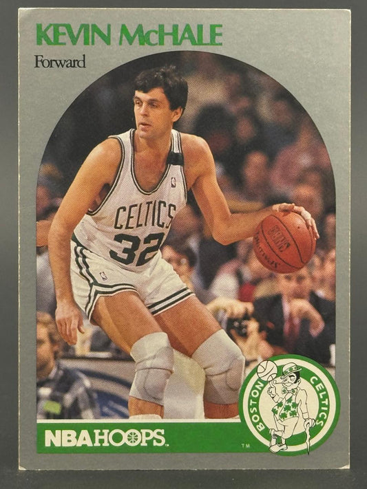Kevin McHale 1989-90 NBA Hoops trading card dribbling a basketball in a Celtics uniform.