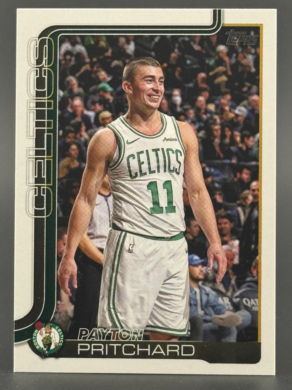 Payton Pritchard basketball card, Topps Celtics #11, smiling on court in uniform.