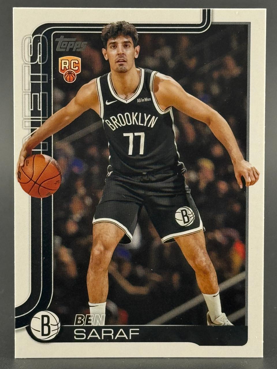 Ben Saraf Topps rookie trading card featuring him in a black Brooklyn 77 jersey dribbling a basketball.