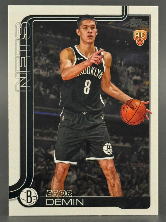 Egor Dëmin Brooklyn Nets rookie trading card, pointing, holding basketball.