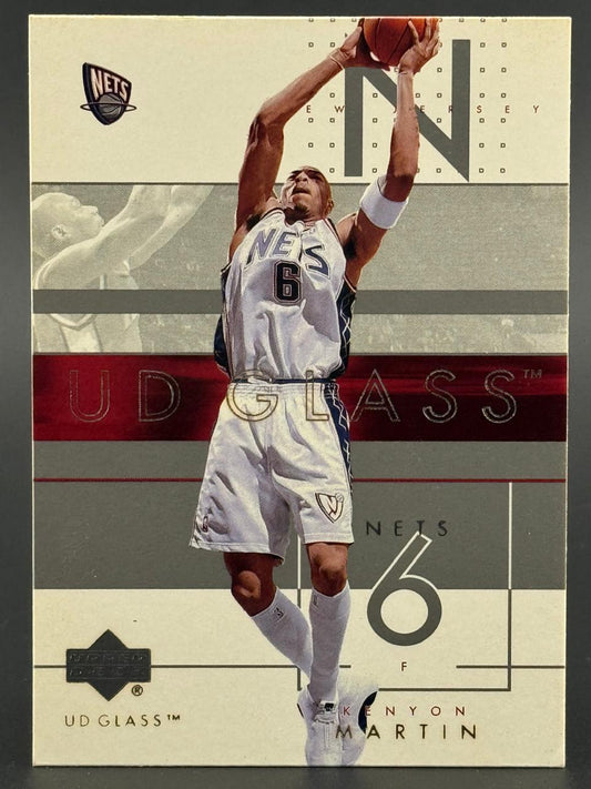 Kenyon Martin 2000-01 UD Glass trading card showing him in a Nets uniform with a basketball.
