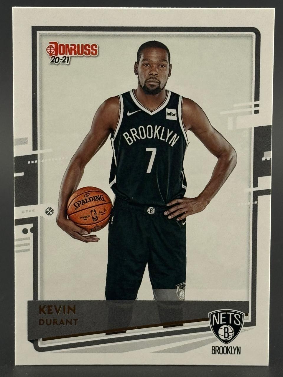 2020-21 Donruss Kevin Durant basketball card featuring him in his Brooklyn Nets uniform holding a basketball.
