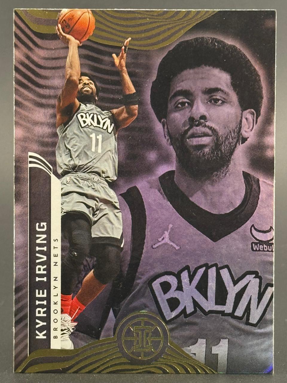 Kyrie Irving trading card featuring action shot and portrait, playing for the Brooklyn Nets.