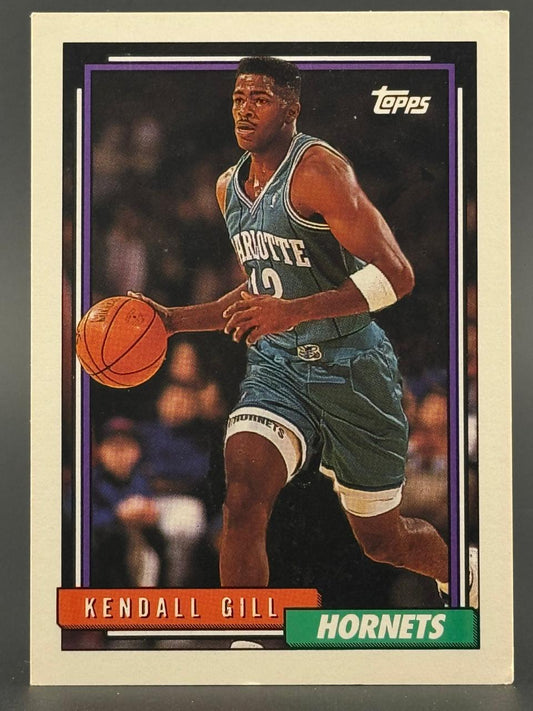 Topps basketball card of Kendall Gill in a Hornets uniform, dribbling a basketball.