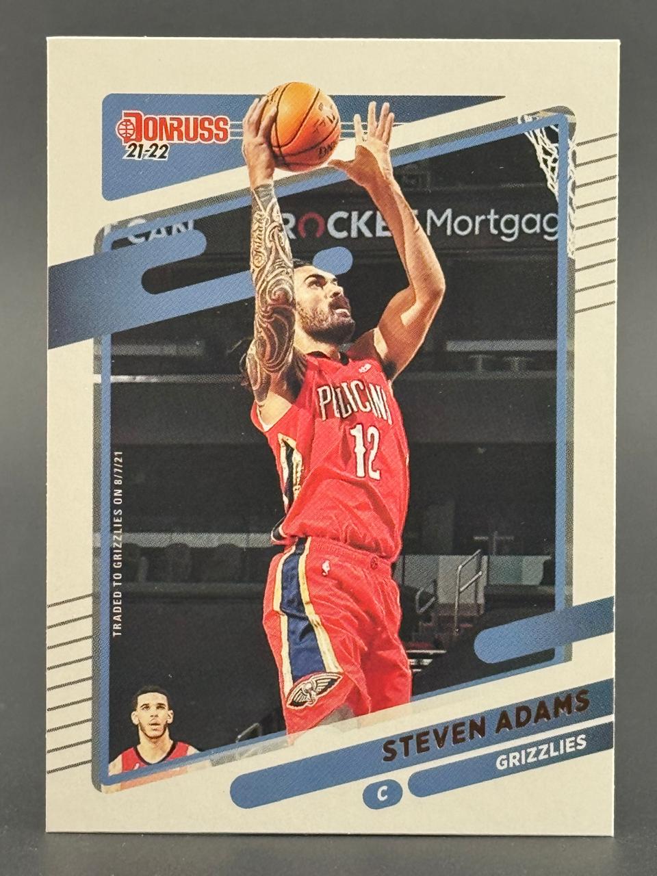 21-22 Donruss Steven Adams basketball card featuring Adams in a red Pelicans uniform shooting.