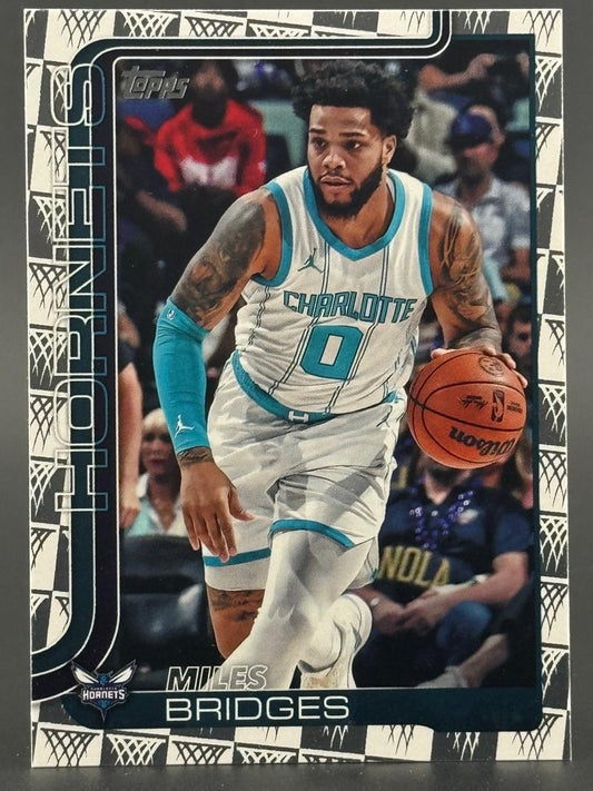 Miles Bridges trading card featuring him in a white Charlotte Hornets uniform dribbling a basketball.