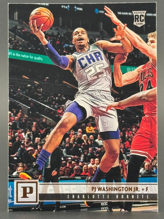 PJ Washington Jr. 2019-20 Panini basketball rookie card showing him driving to the basket in a Hornets uniform.