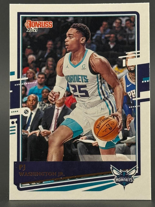 2020-21 Donruss PJ Washington Jr. basketball card (#25) depicting him dribbling in a Hornets uniform.