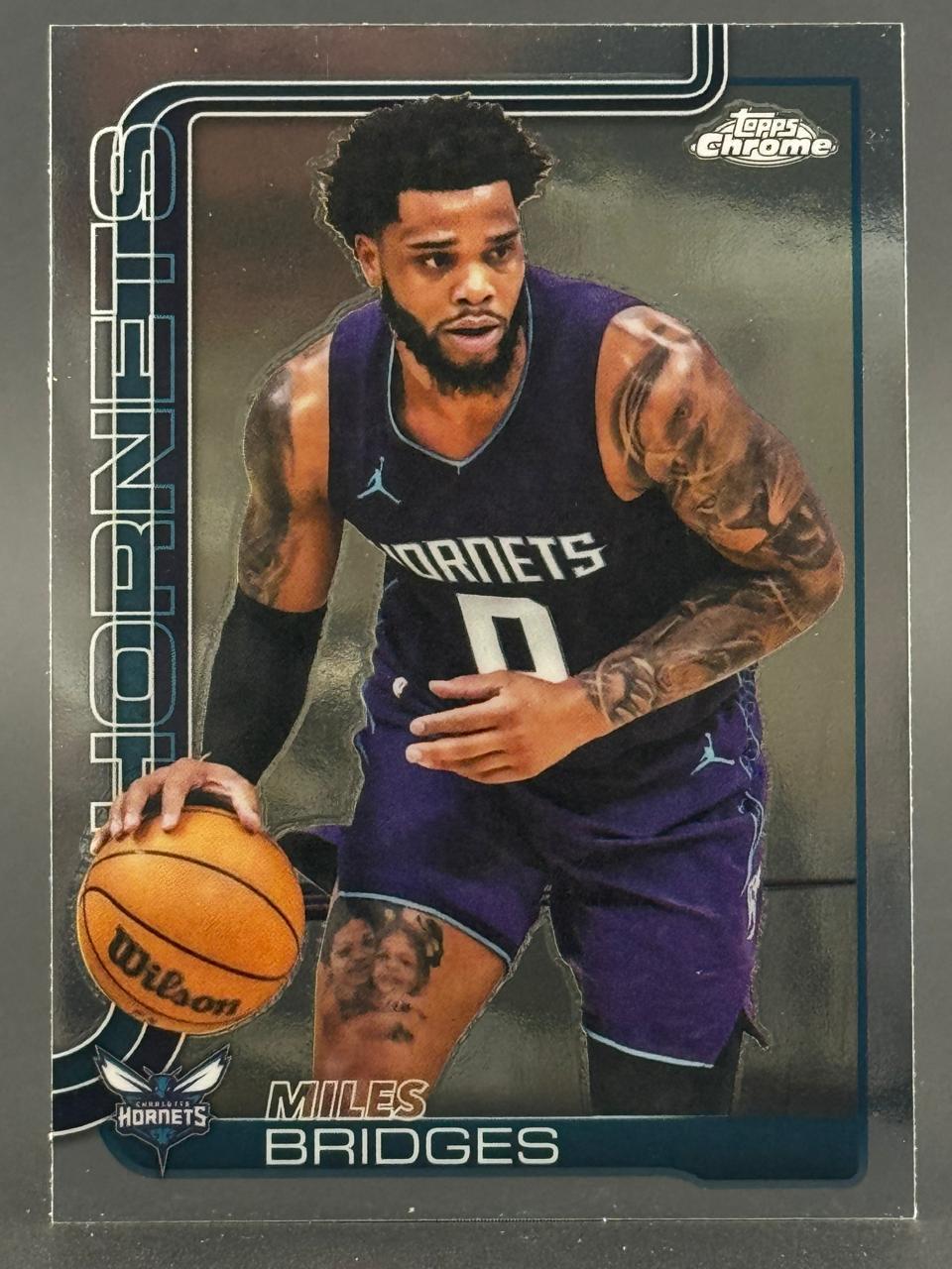 Miles Bridges Topps Chrome basketball card, dribbling a Wilson ball in a Hornets uniform.