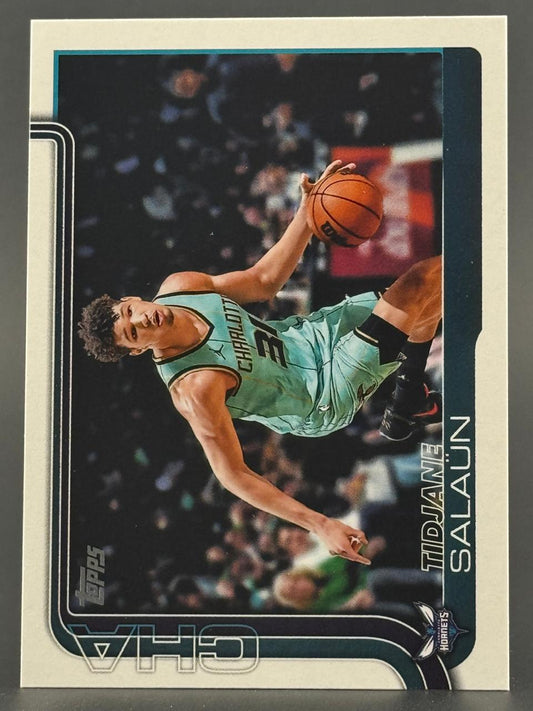 Trading card of Tidjane Salaün in a teal Charlotte Hornets uniform dribbling a basketball.