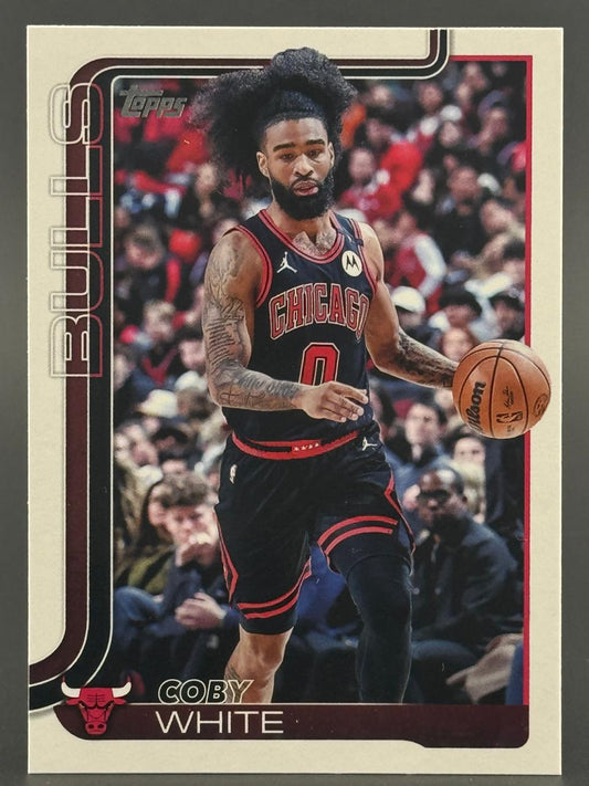 Trading card of Coby White in a Chicago Bulls uniform dribbling a basketball.