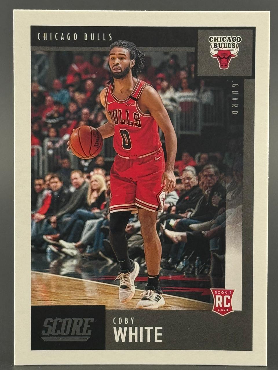 Coby White 2019-20 Score basketball rookie trading card dribbling.