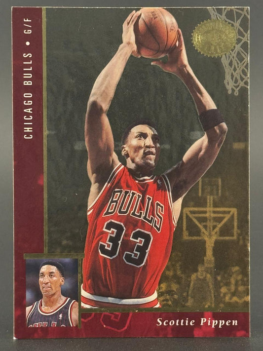 Trading card of Scottie Pippen, Chicago Bulls, holding a basketball overhead.