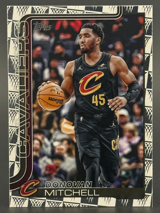 Donovan Mitchell basketball card in black Cleveland Cavaliers uniform dribbling a ball.