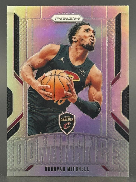 Donovan Mitchell on a Panini Prizm Dominance basketball card holding a basketball in a Cavaliers uniform.
