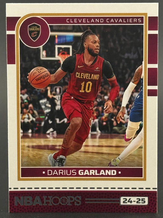 24-25 NBA Hoops Darius Garland trading card featuring the Cleveland Cavaliers guard dribbling in a game.