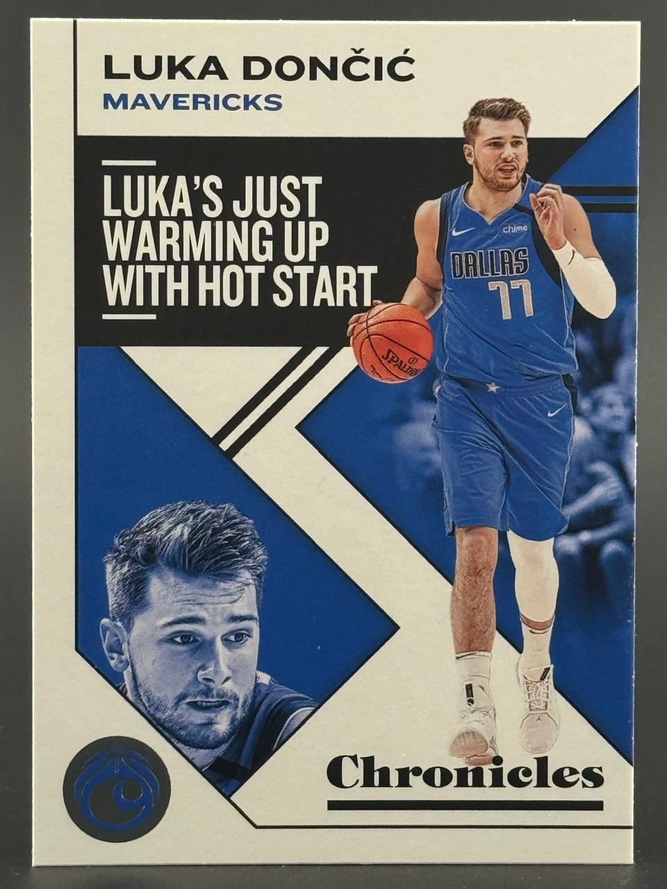Luka Dončić 2020-21 Chronicles basketball card showing the Mavericks guard dribbling.
