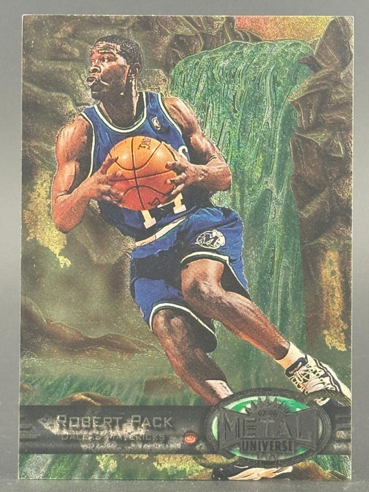 1997-98 Metal Universe Robert Pack trading card featuring him in a Dallas Mavericks uniform holding a basketball.