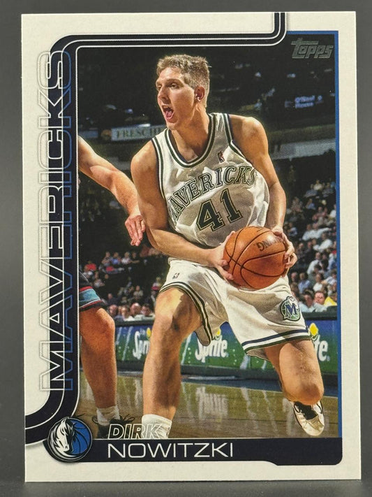 Dirk Nowitzki 1998-99 Topps basketball card, showing him in a Mavericks uniform holding a ball.