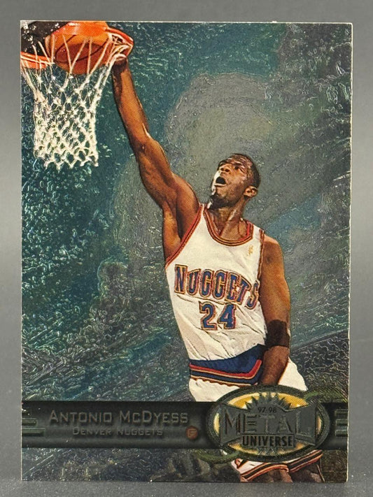 1997-98 Metal Universe Antonio McDyess basketball trading card featuring him dunking for the Denver Nuggets.