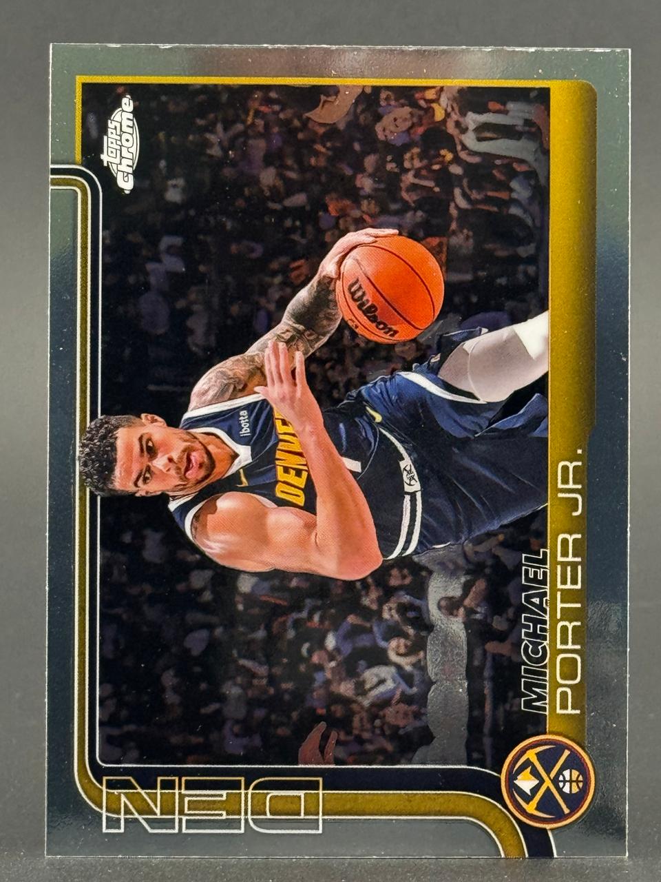 Topps Chrome Michael Porter Jr. basketball trading card, showing him in a Denver uniform holding a basketball.