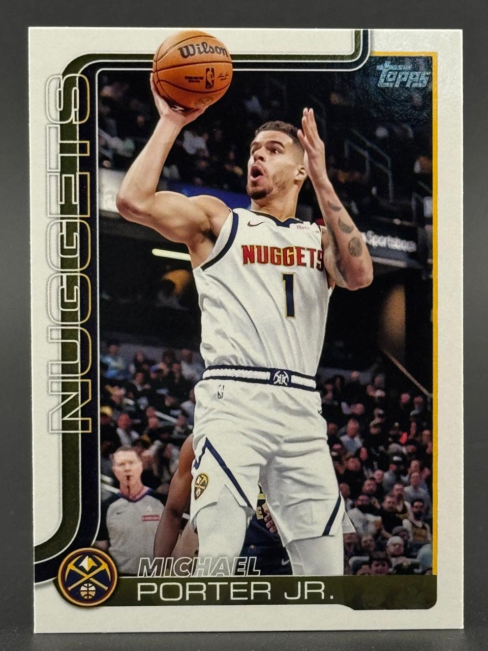 Michael Porter Jr. basketball card in a white Nuggets uniform, holding a basketball overhead.