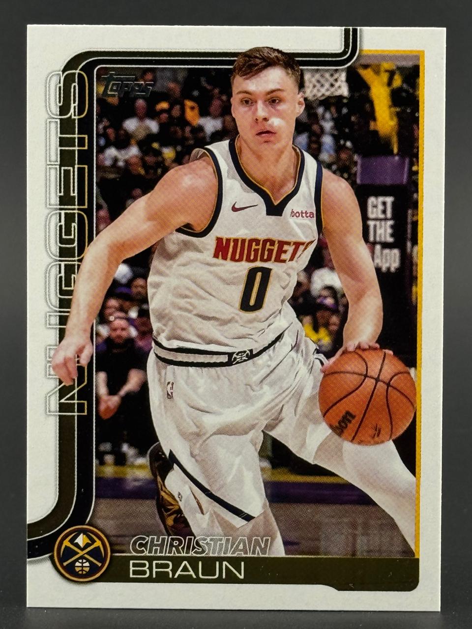 Christian Braun Topps basketball card, depicting him dribbling in a Nuggets uniform.
