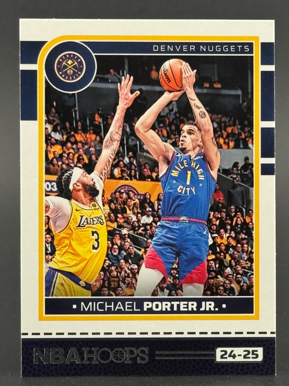 24-25 NBA Hoops trading card of Michael Porter Jr. shooting over Anthony Davis.