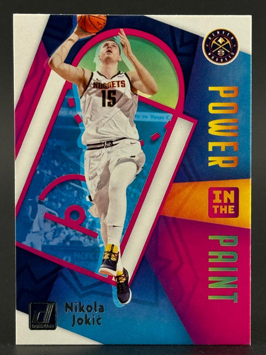 Nikola Jokić Power in the Paint trading card, showing him shooting a basketball in a Denver Nuggets jersey.