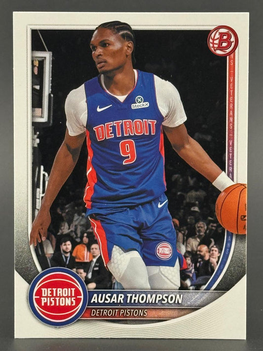 Ausar Thompson trading card featuring him in a blue Detroit Pistons jersey dribbling a basketball.