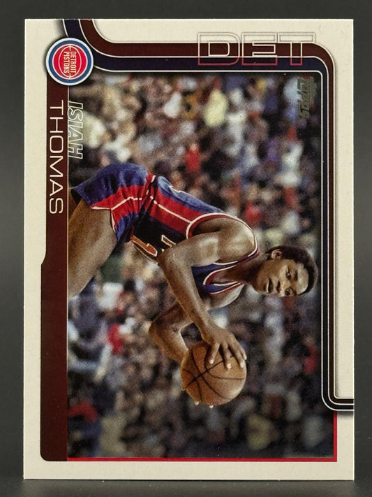 Isiah Thomas Detroit Pistons basketball card holding a basketball.