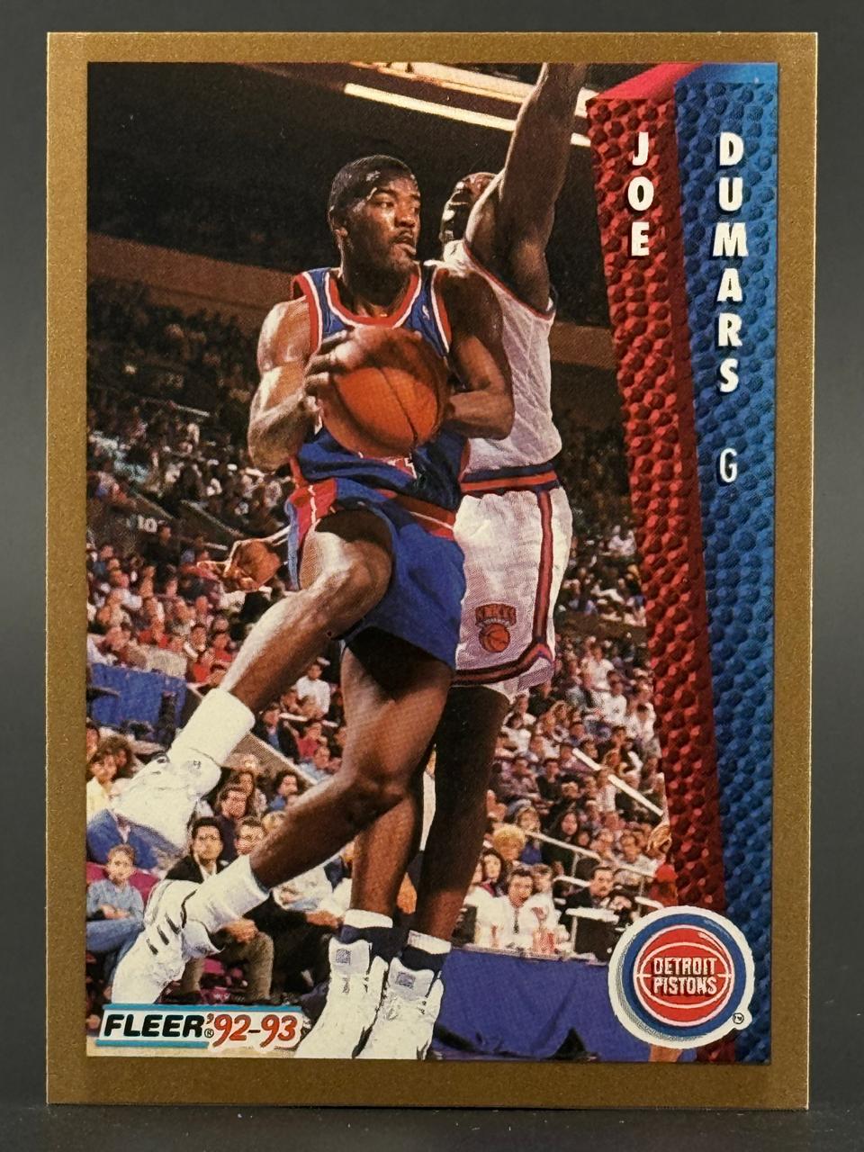 1992-93 Fleer Joe Dumars basketball card featuring him driving past a defender.