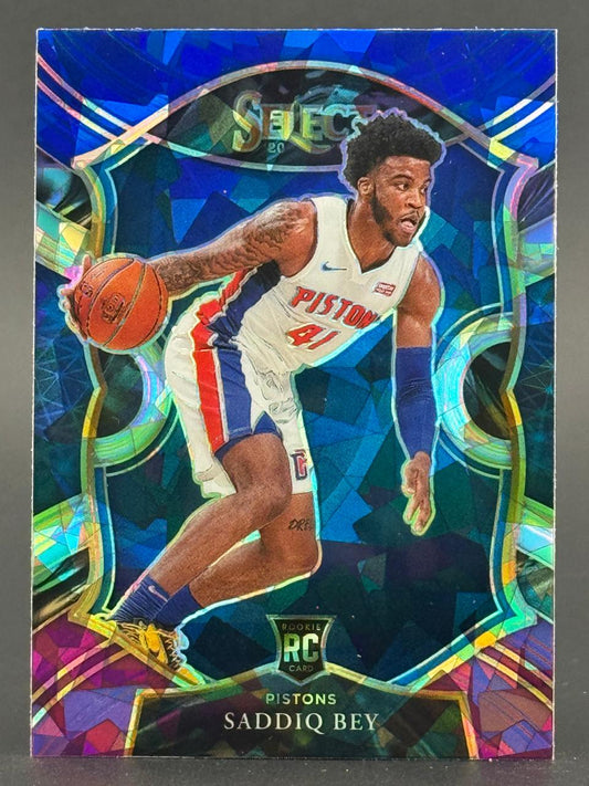 Saddiq Bey 2020 Select RC trading card showing him dribbling in a Pistons uniform.