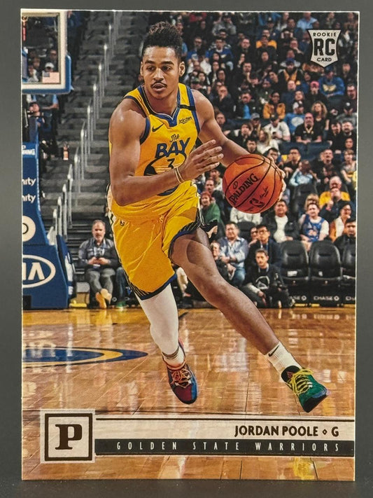 Jordan Poole 2019-20 Panini basketball rookie card dribbling in a yellow Golden State Warriors uniform.