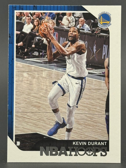 Kevin Durant NBA Hoops trading card showing him holding a basketball in a Warriors uniform.