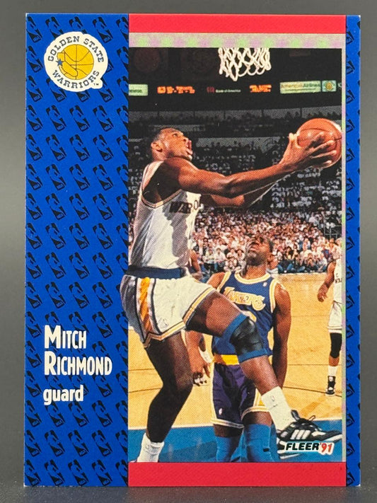 1991 Fleer Mitch Richmond basketball card showing him driving to the basket.