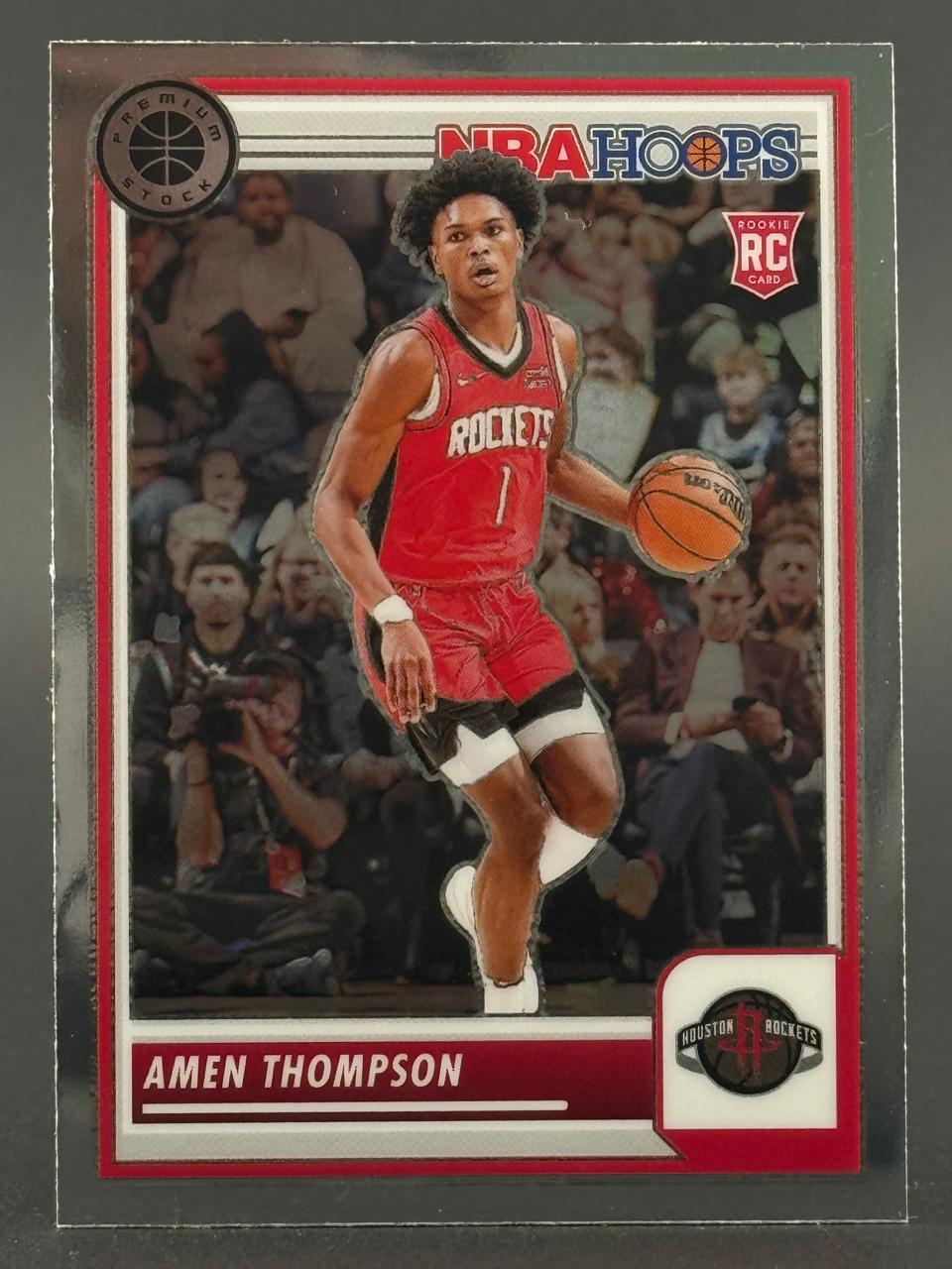 Amen Thompson 2023-24 NBA Hoops Premium Stock rookie card dribbling a basketball.
