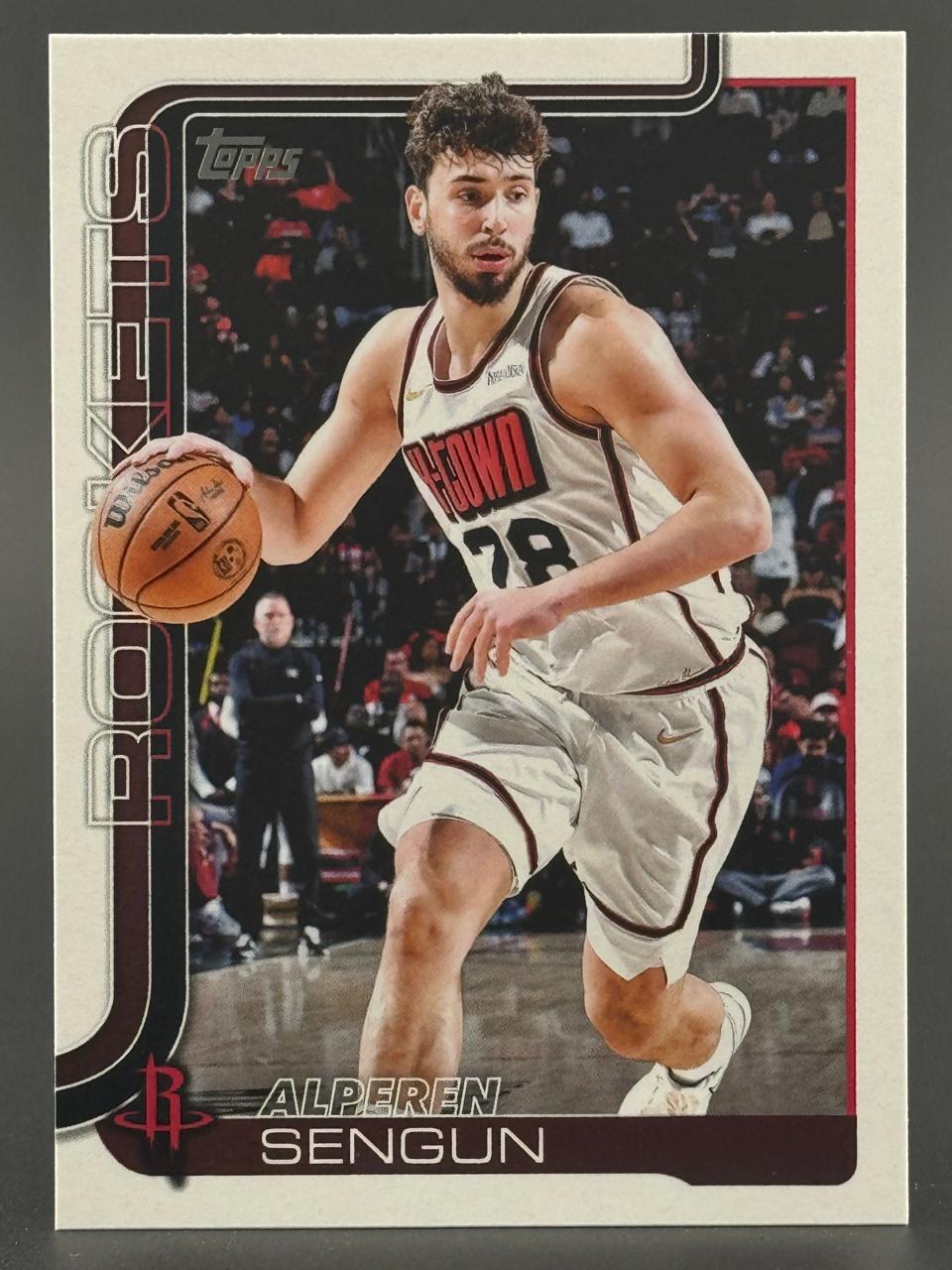 Alperen Sengun basketball trading card, Topps set, featuring Sengun dribbling in a Rockets uniform.