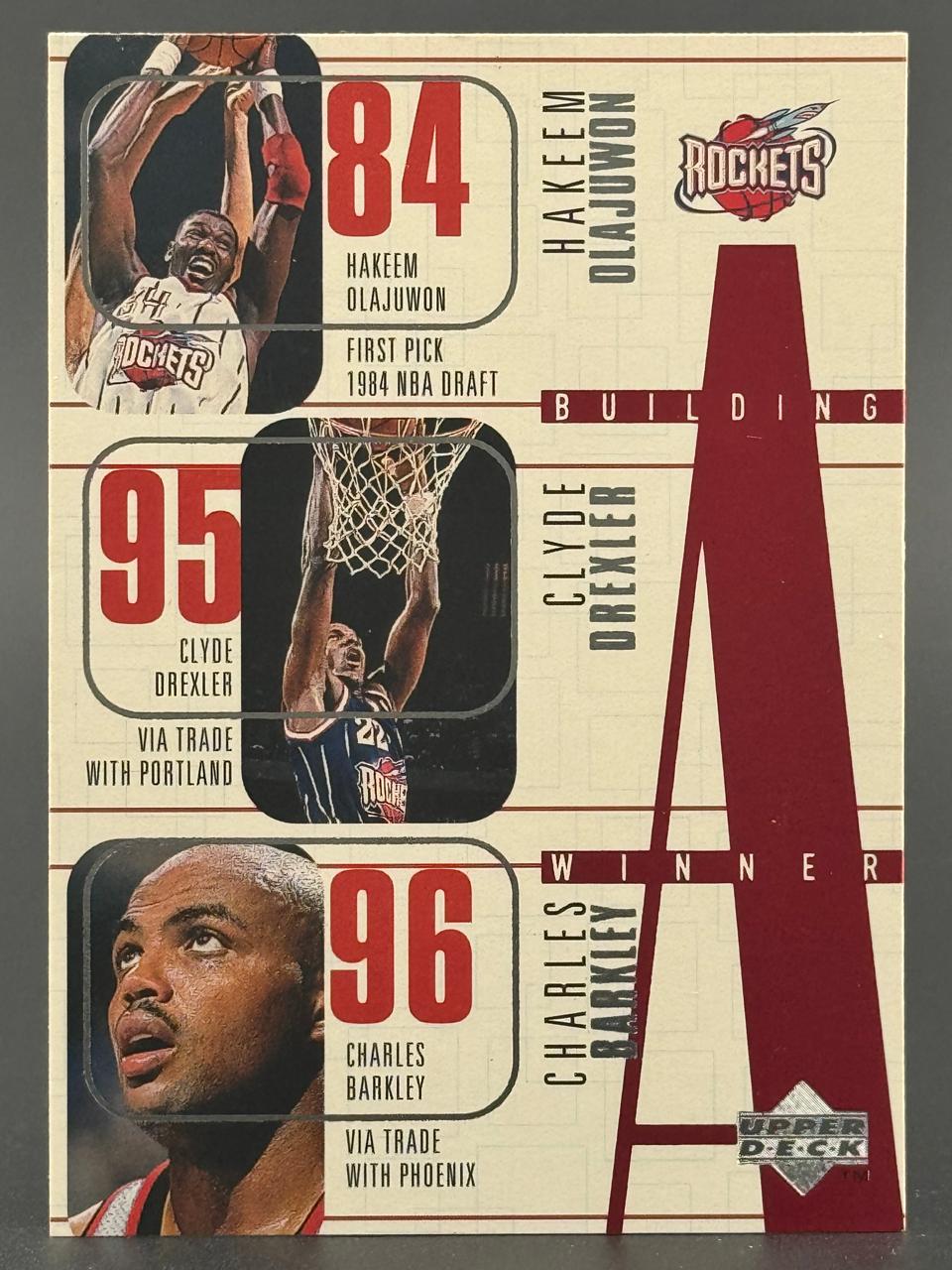 1995-96 Upper Deck Building a Winner card featuring Hakeem Olajuwon, Clyde Drexler, and Charles Barkley.