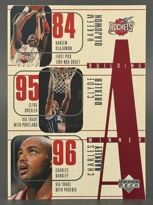 1995-96 Upper Deck Building a Winner card featuring Hakeem Olajuwon, Clyde Drexler, and Charles Barkley.